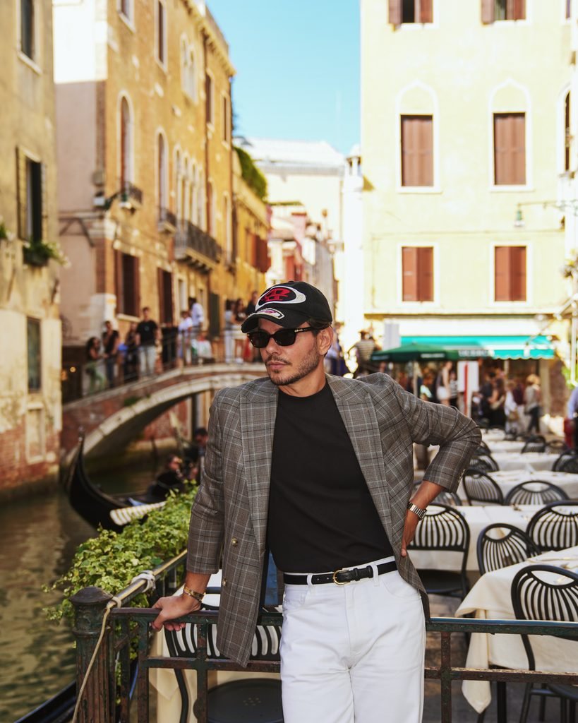 Daniel Marin at a canalside restaurant terrace next to a bridge in Venice