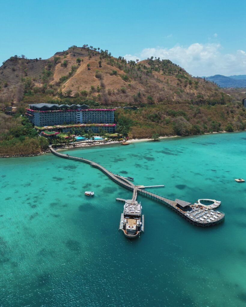 Aerial view of Ayana Komodo Waecicu Beach resort and its jetty in Labuan Bajo