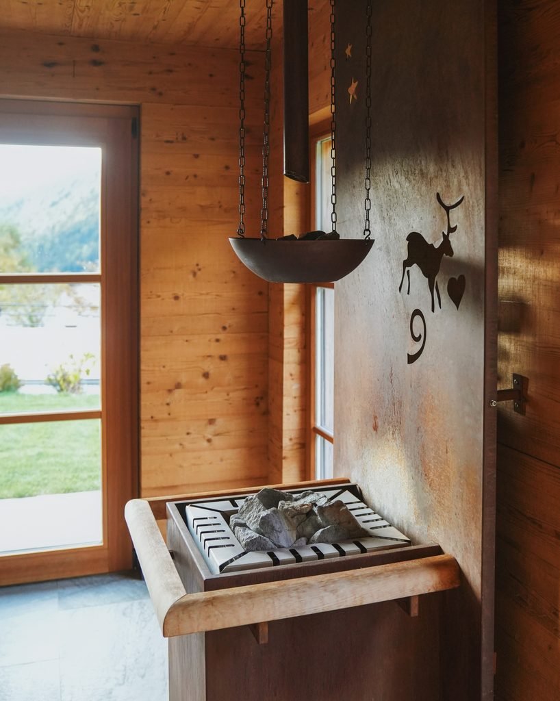 Inside the wooden Finnish infusion sauna at Hotel Masl spa in the Dolomites